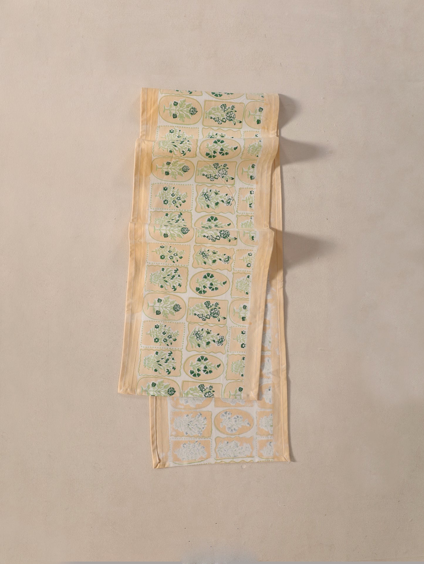 Green parrot and yellow motif tiles table runner