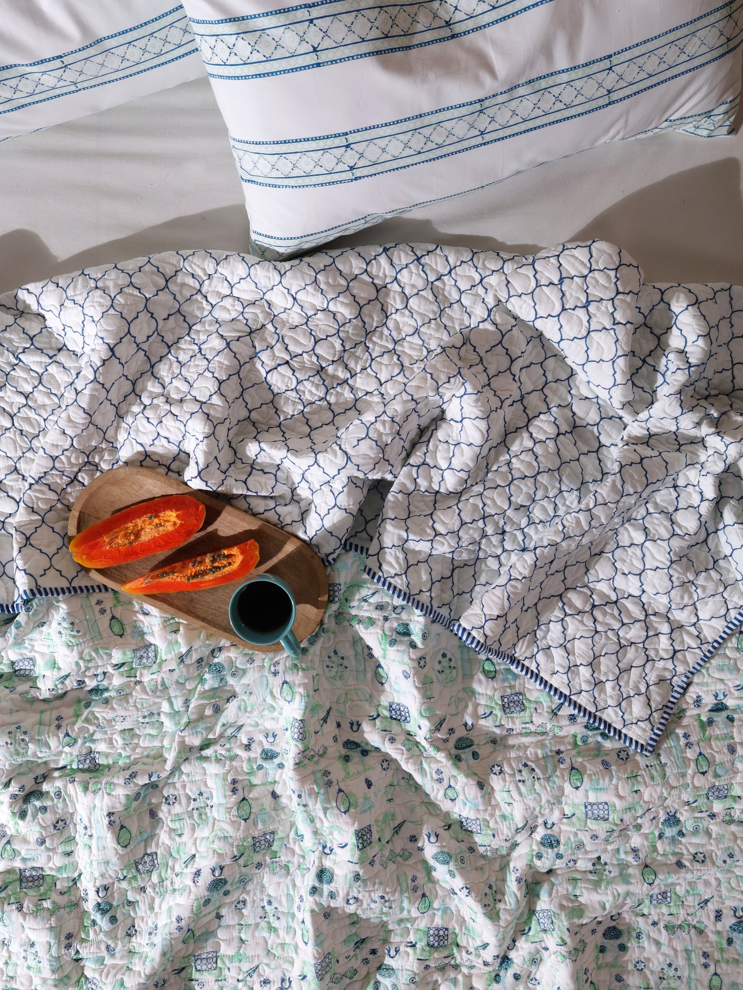 Blue and sea green scattered ethnic mulmul quilt