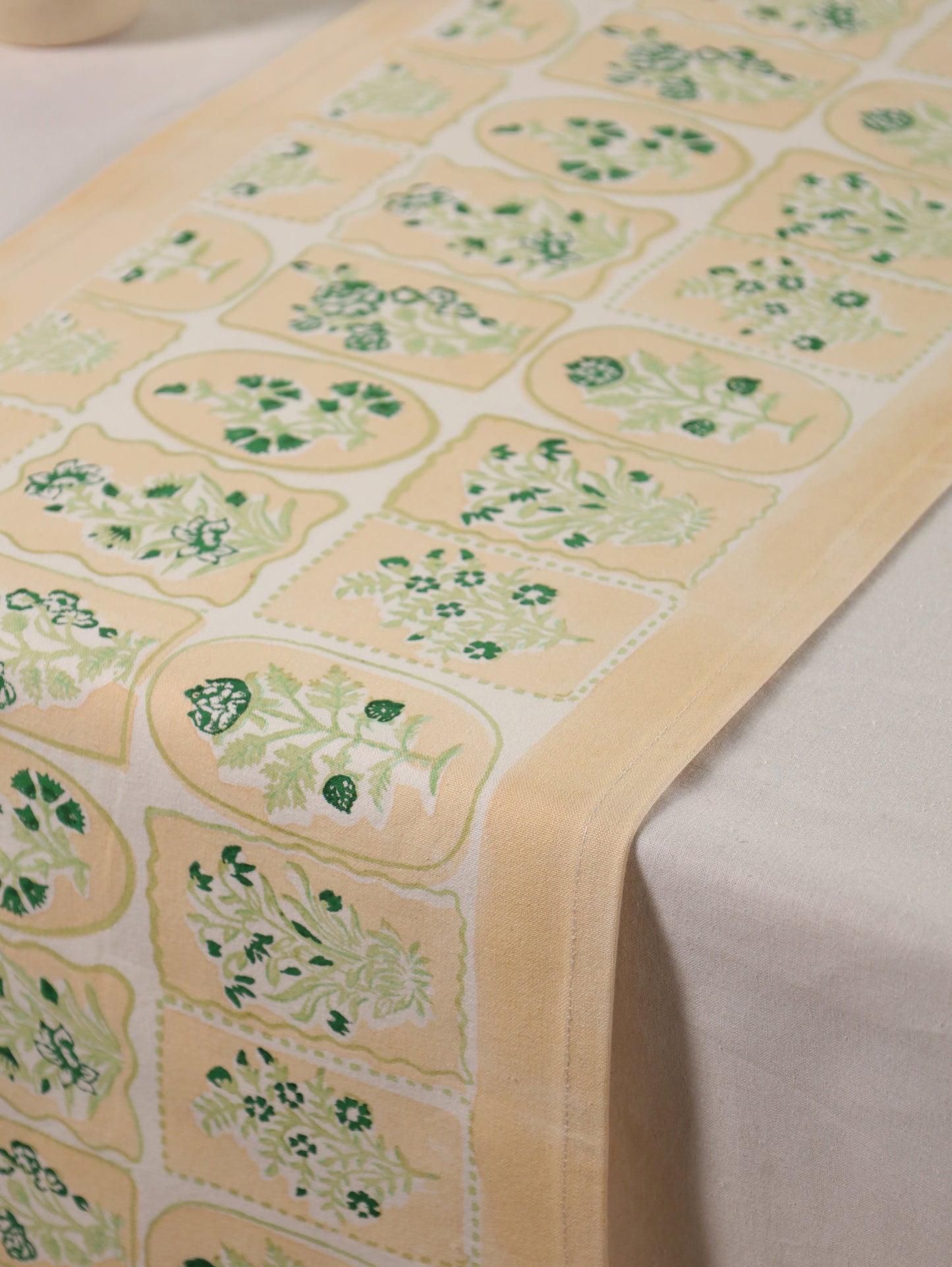 Green parrot and yellow motif tiles table runner