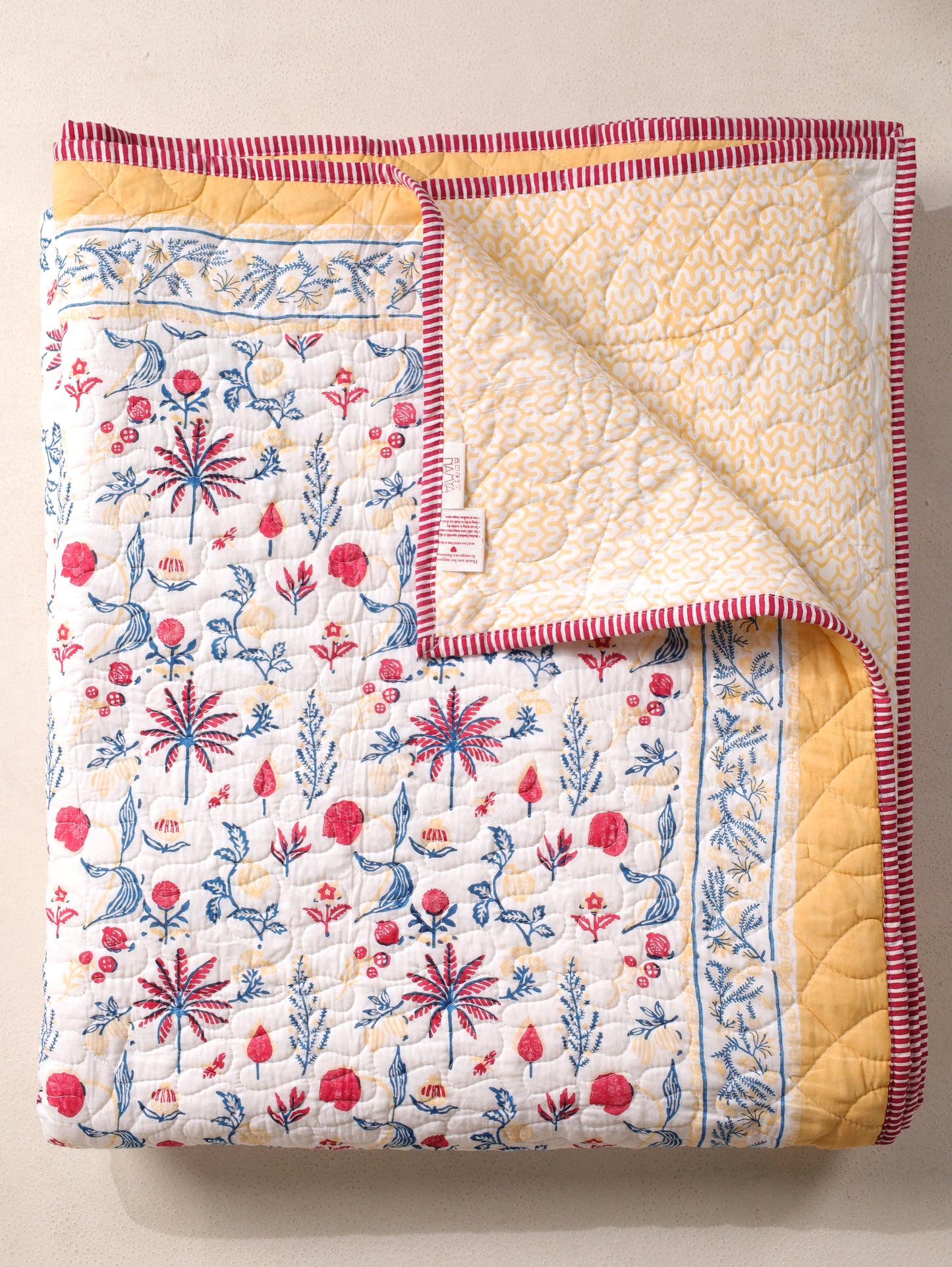 Magenta yellow and blue nariyal tree mulmul quilt (scattered floral)