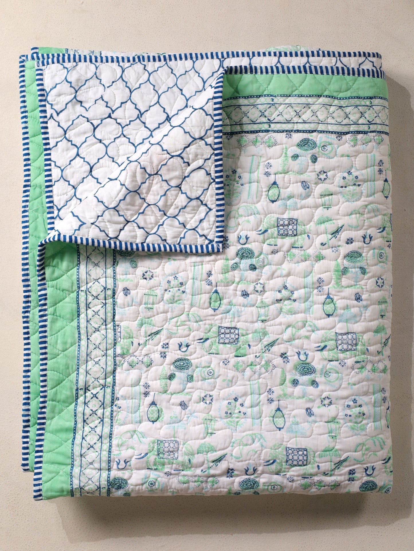 Blue and sea green scattered ethnic mulmul quilt