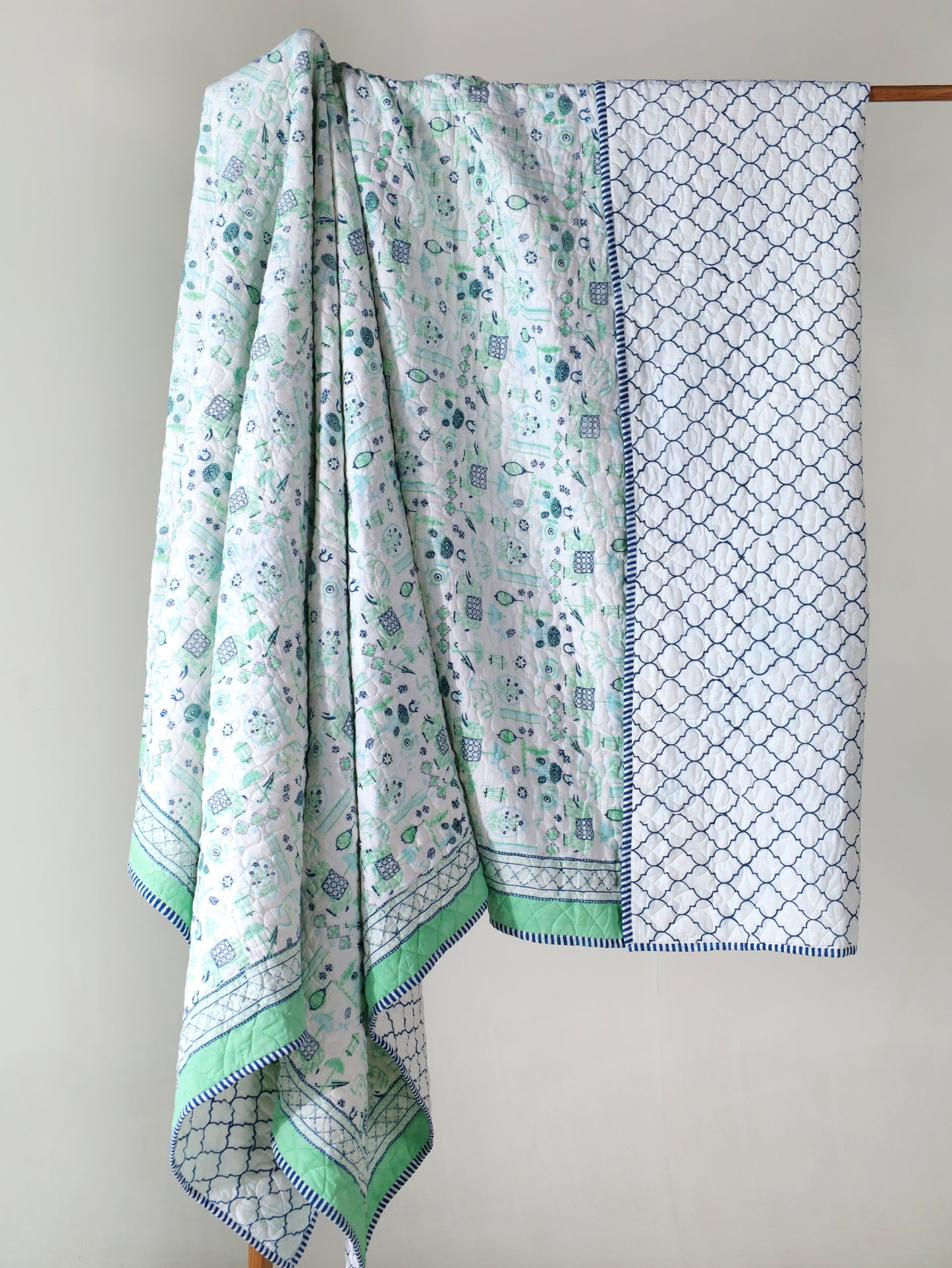 Blue and sea green scattered ethnic mulmul quilt