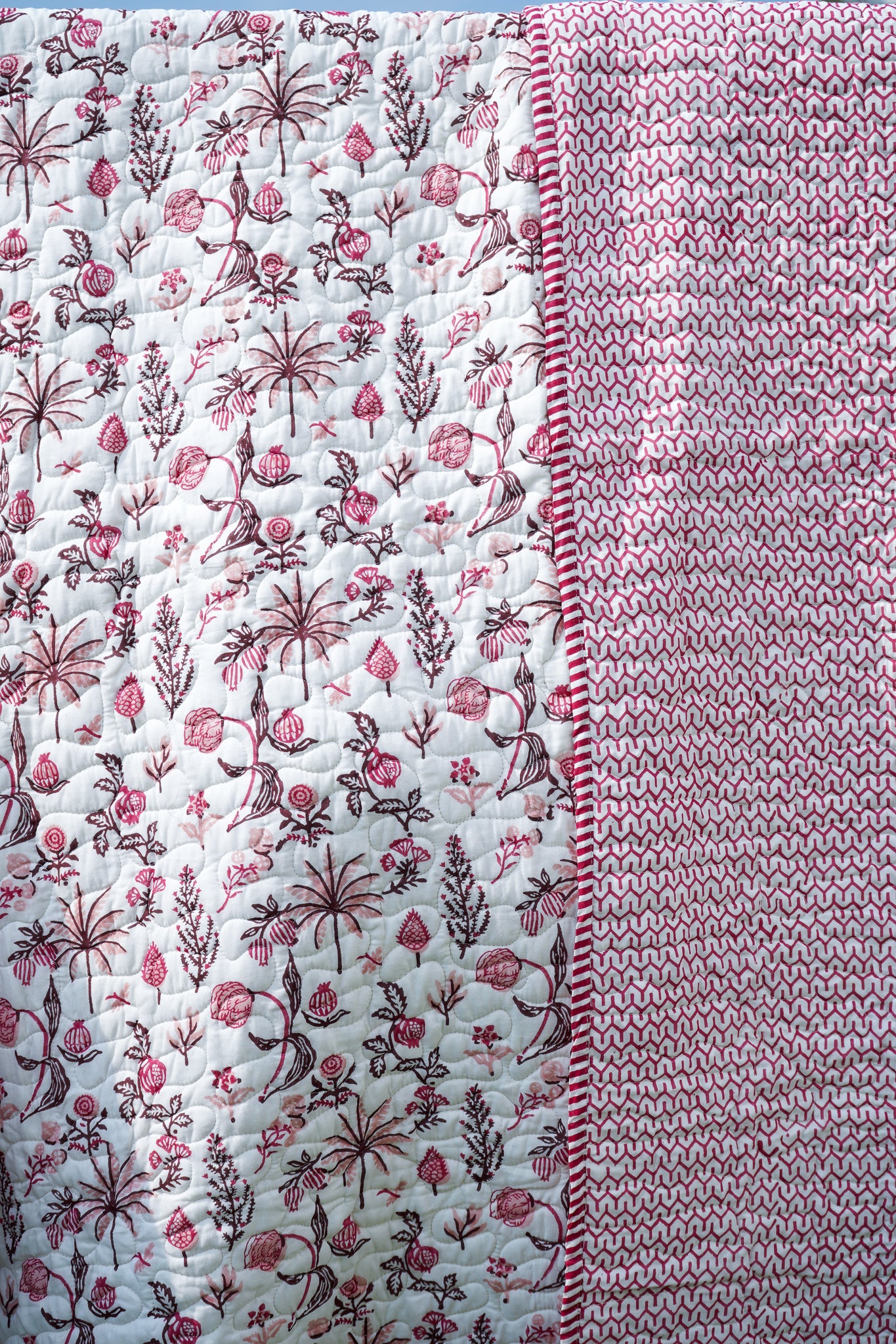 Magenta and maroon nariyal tree mulmul quilt (scattered floral)