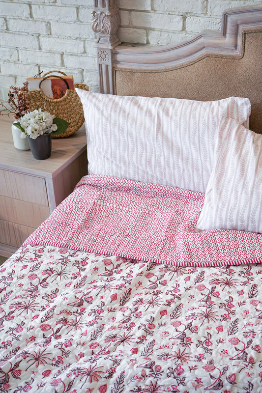 Magenta and maroon nariyal tree mulmul quilt (scattered floral)