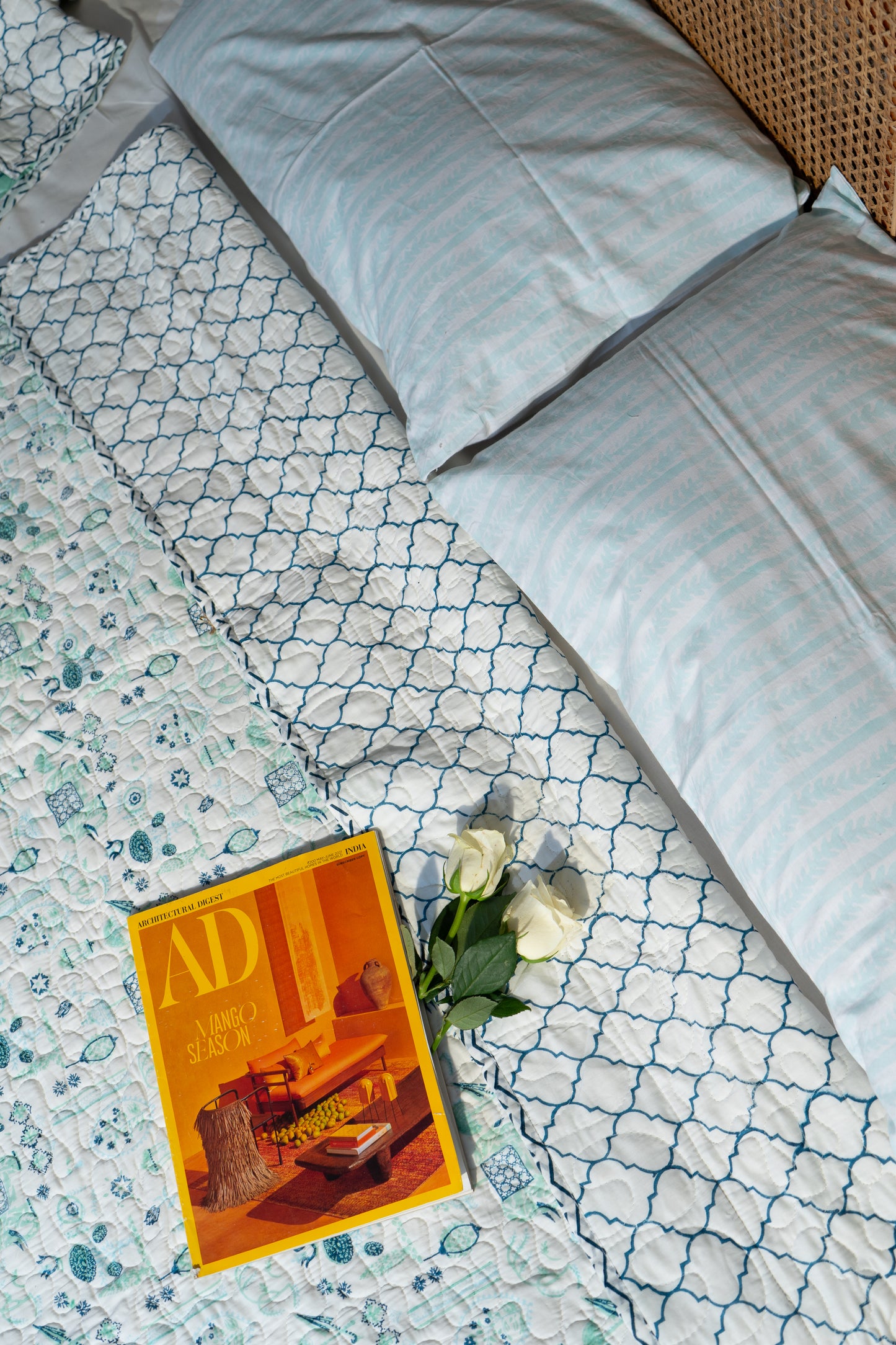 Blue and sea green scattered ethnic mulmul quilt